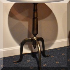 F66a. One of a pair of round metal side table. Marked on top. 24”h x17”w - $95